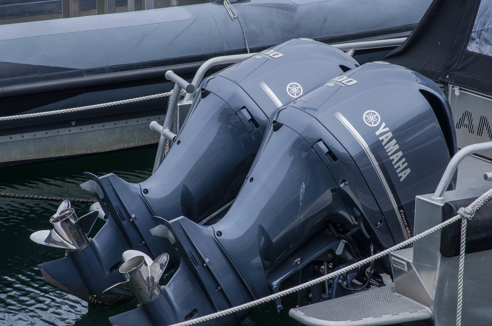 A pair of Yamaha outboard engines attached on a plate boat.