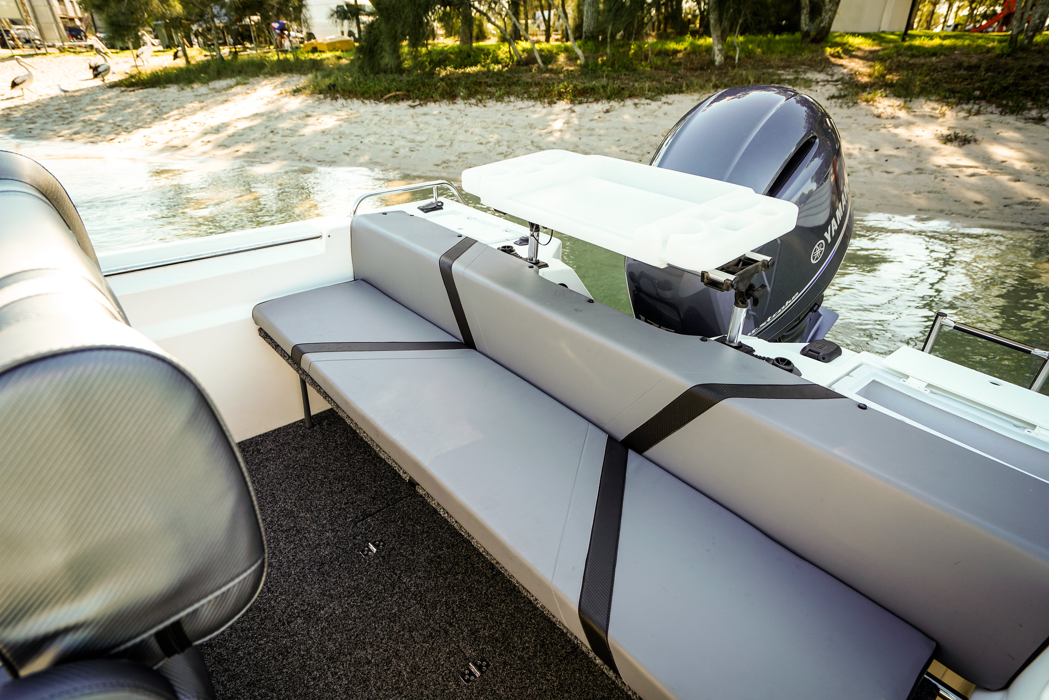 A low angle shot of a rear boat seat of an open boat.