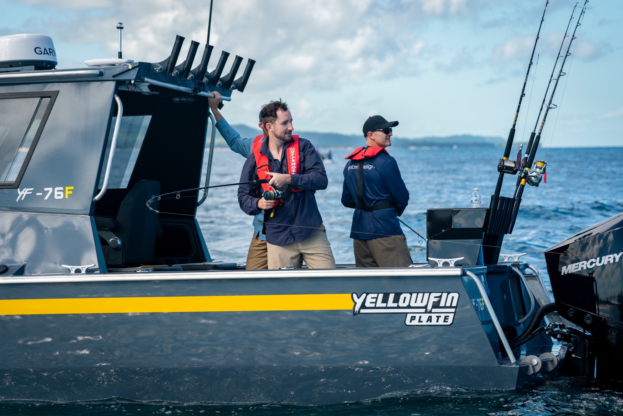 Men aboard a Yellowfin plate boat.