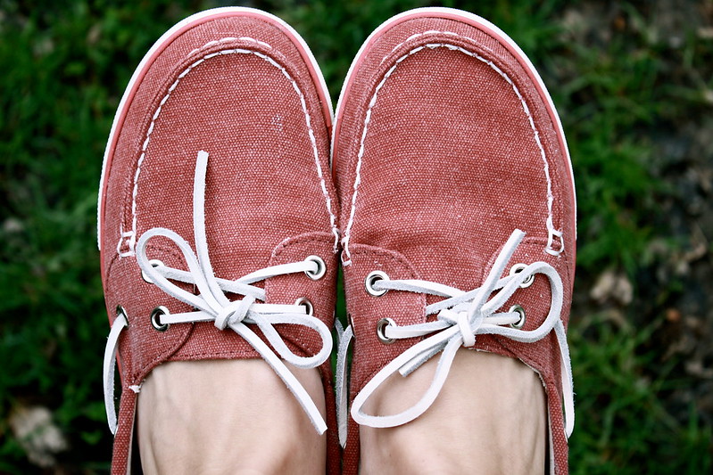 A pair of red boat shoes.