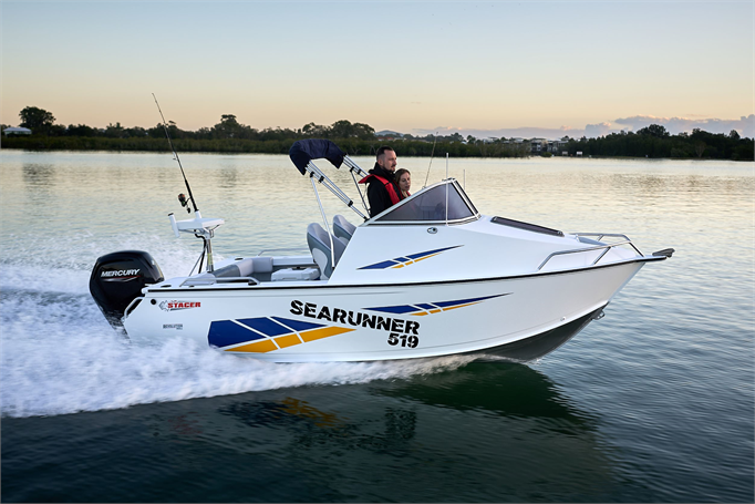 Stacer Sea Runner manned by two people on a lake.