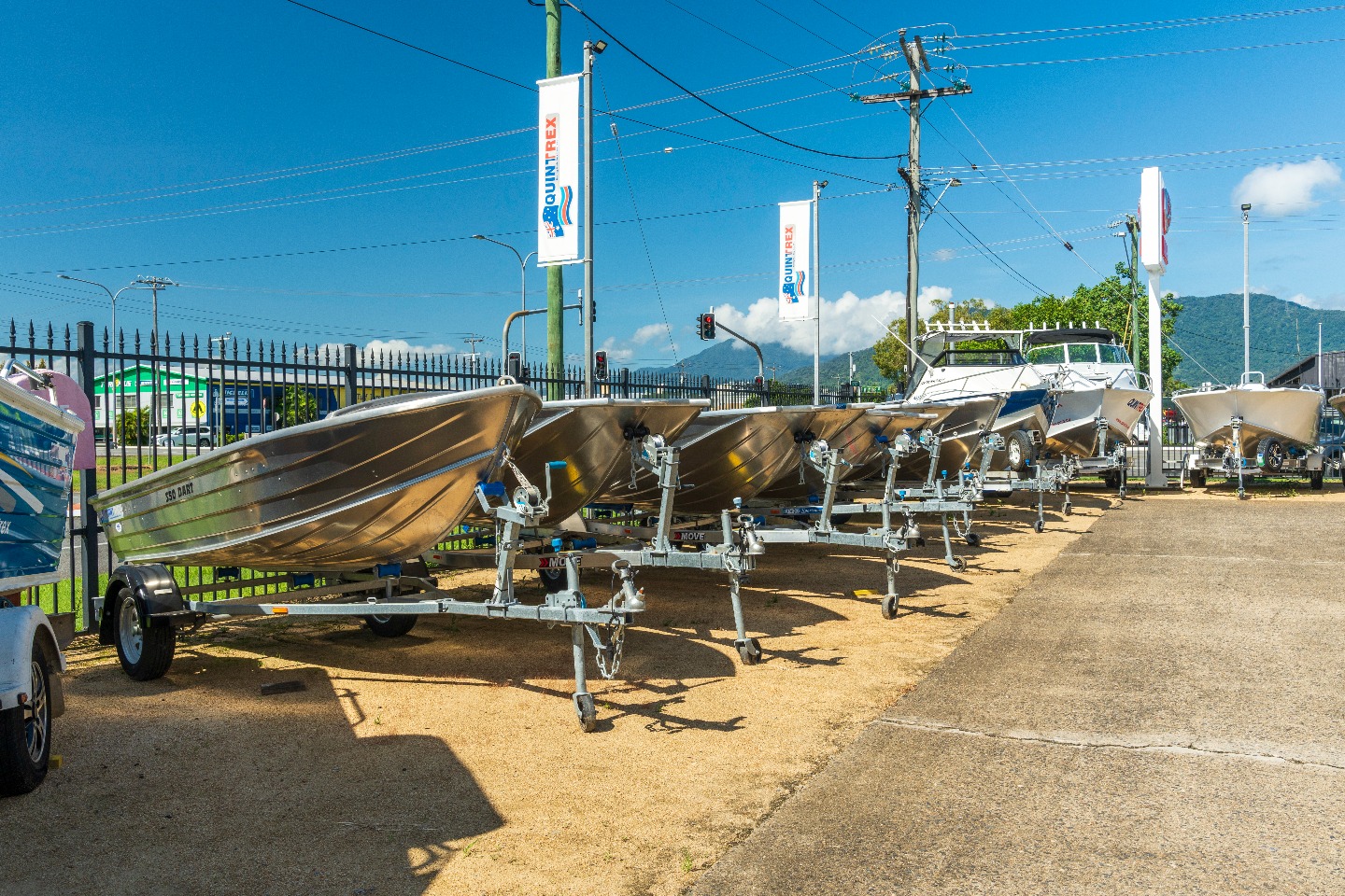 A row of Quintrex tinnies sitting on top of Move Boat Trailers.