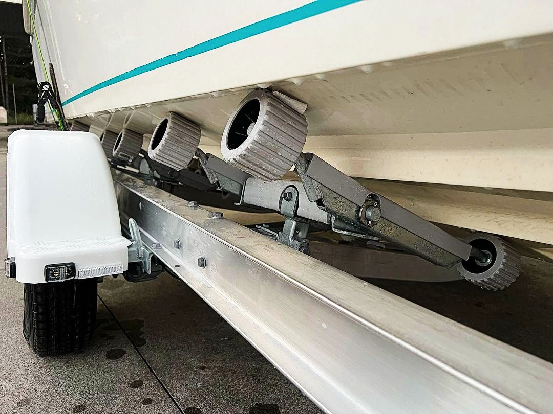 A close up of roller brakes of a boat trailer.