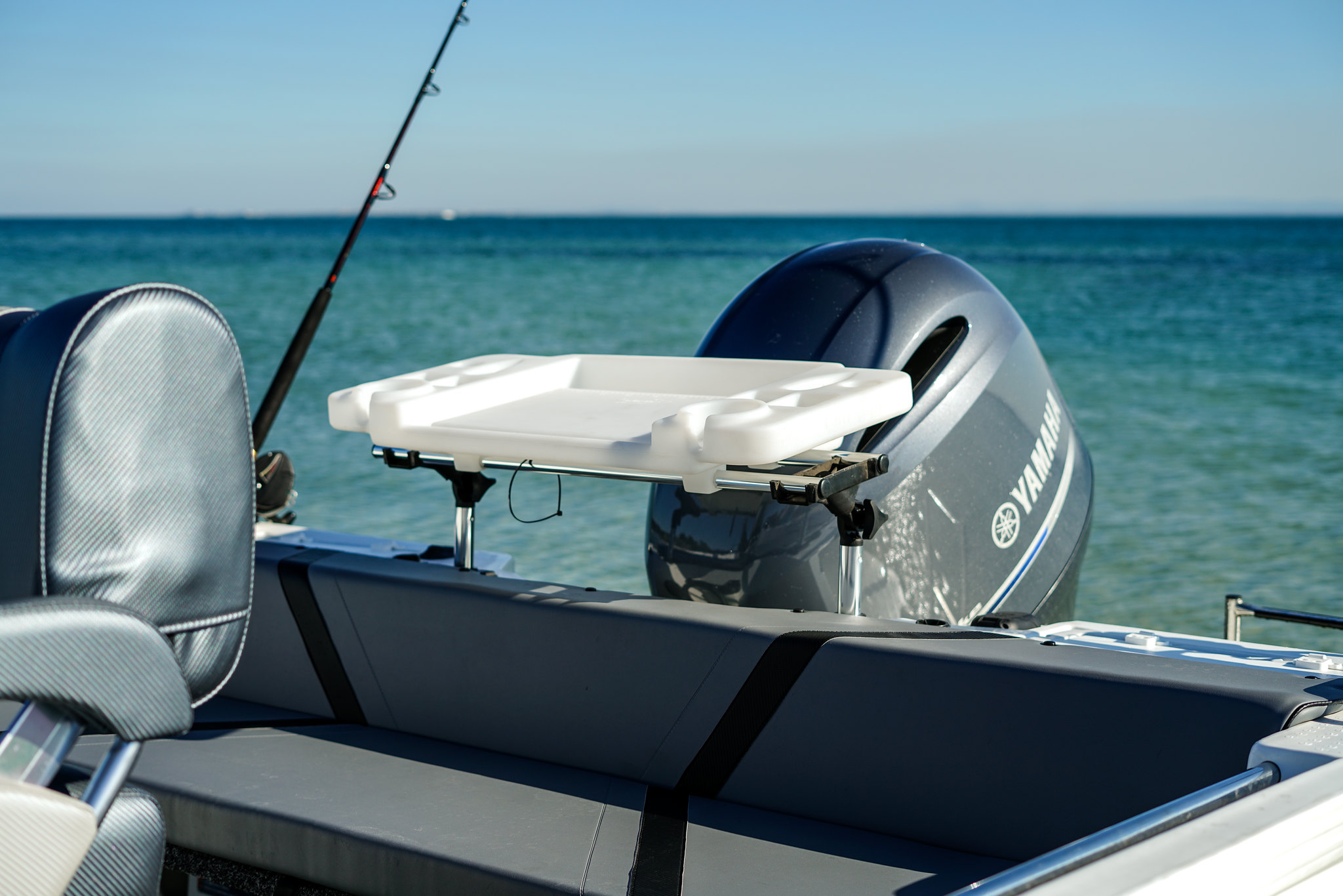 A bait board placed at the back of a fishing boat.