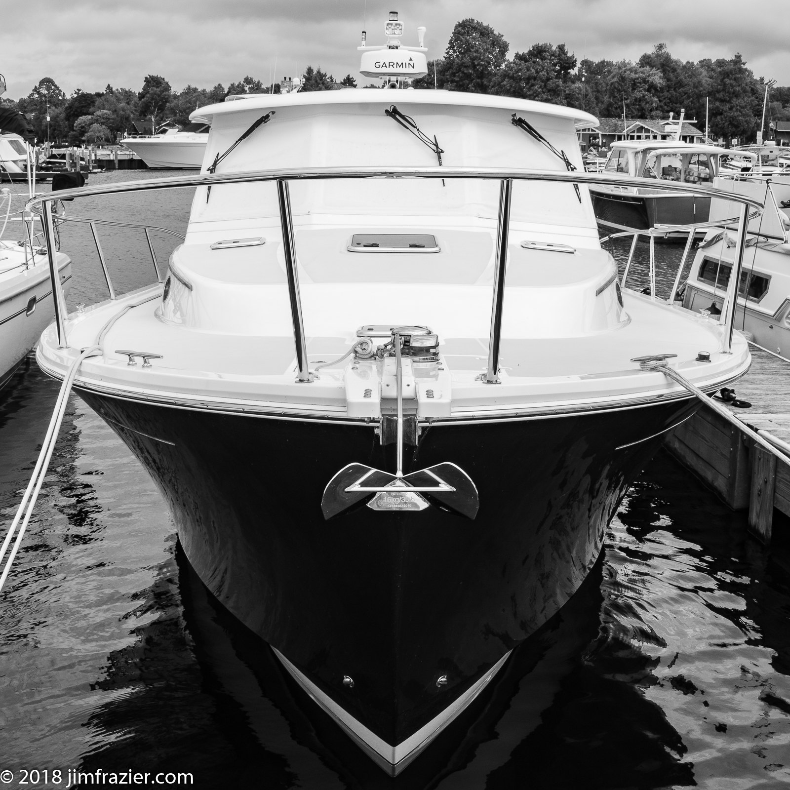 A black and white photo of a boat with a radar on top. Photo by Jim Frazier.