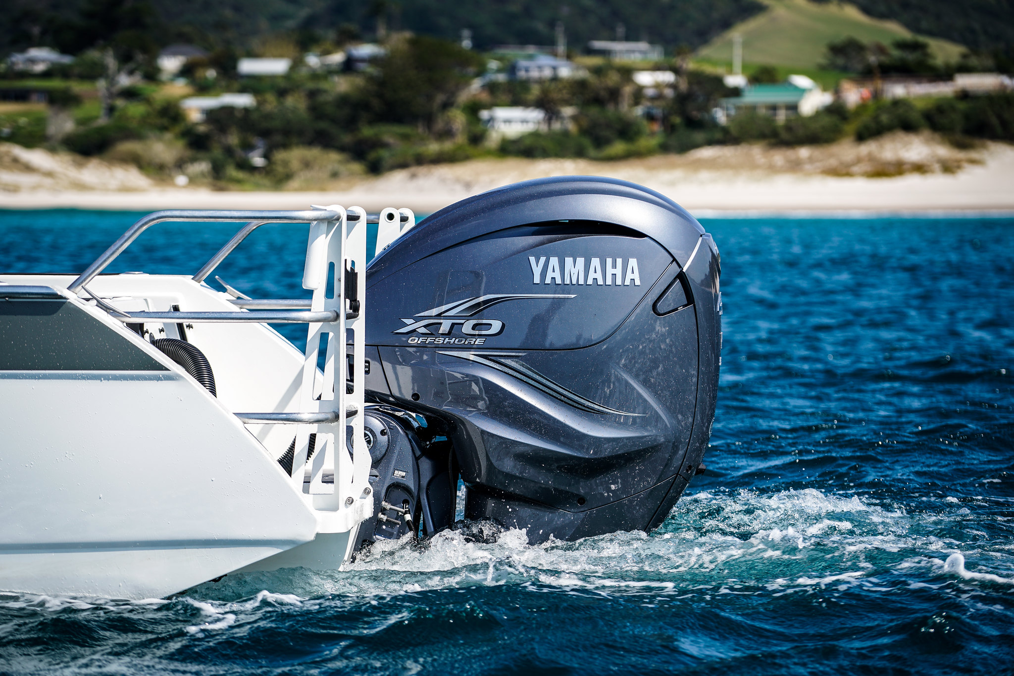 A medium shot of Yamaha boat engine running on idle.