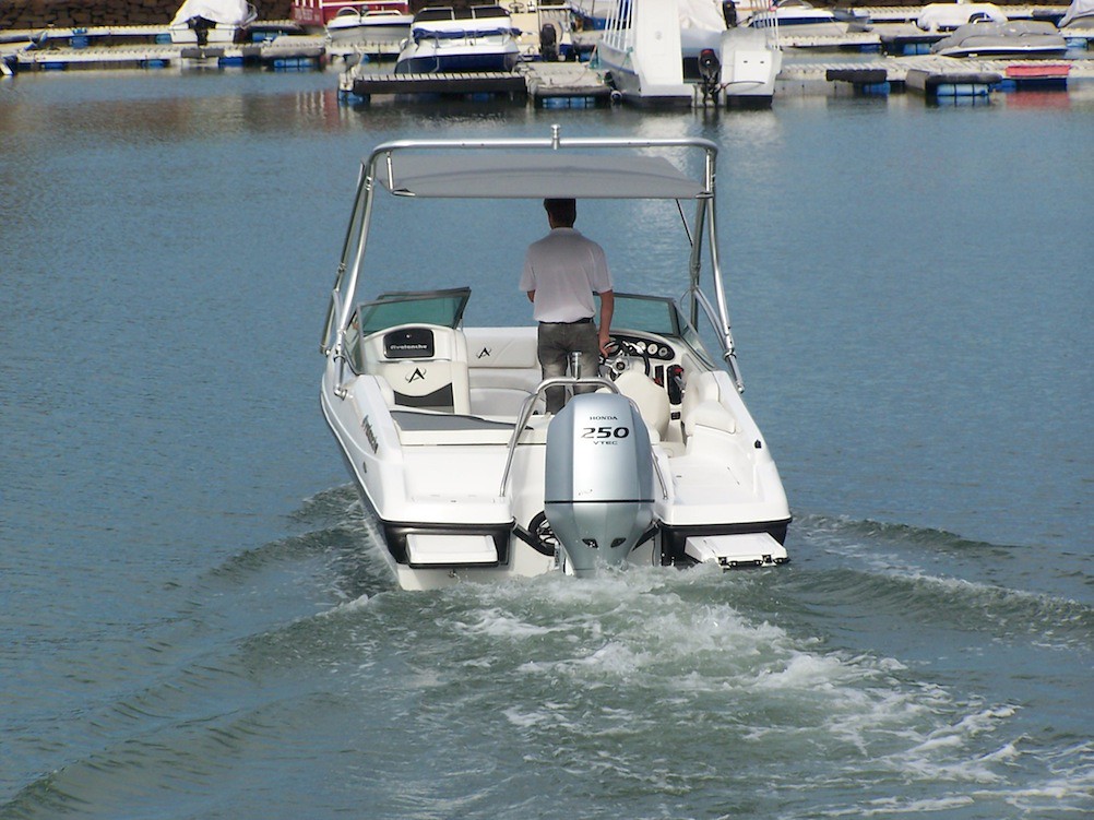 An open boat with a Bimini top