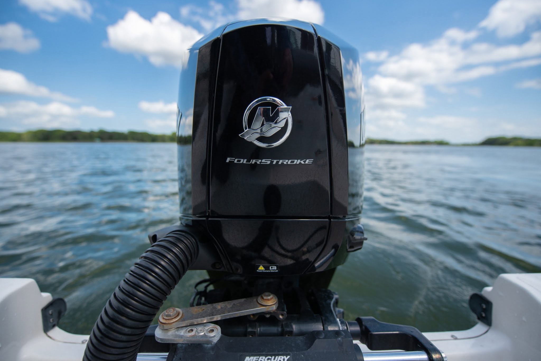 A closeup of a Mercury fourstroke outboard motor