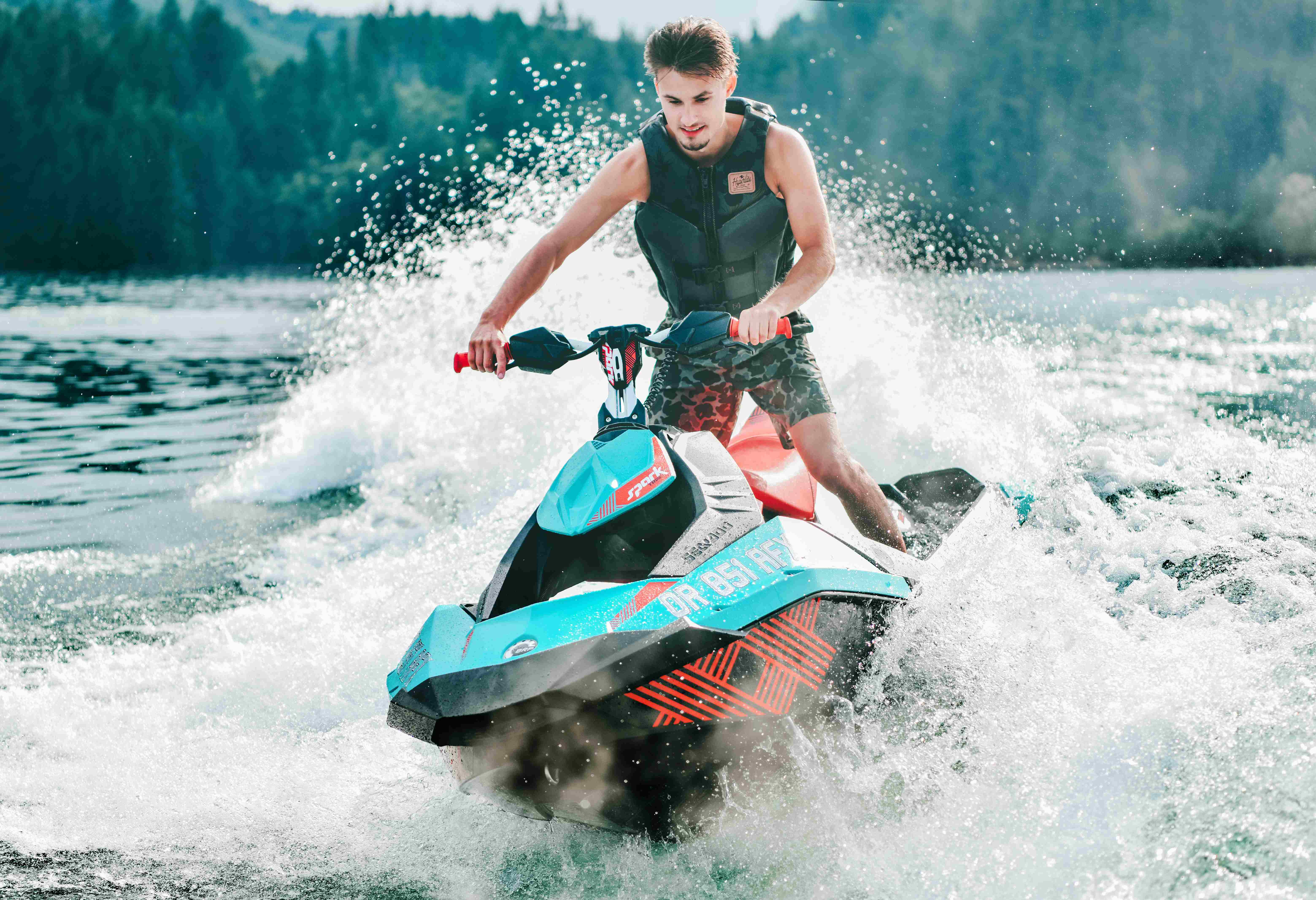 A man riding on a jet ski.