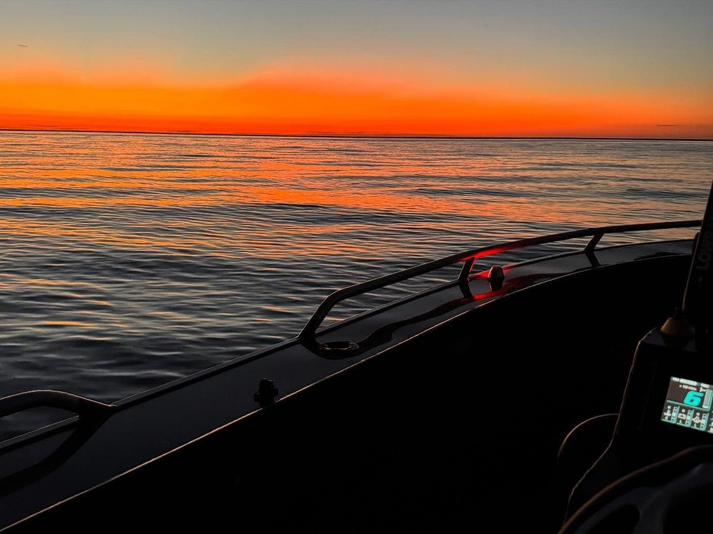 quintrex boat at sea during sunset