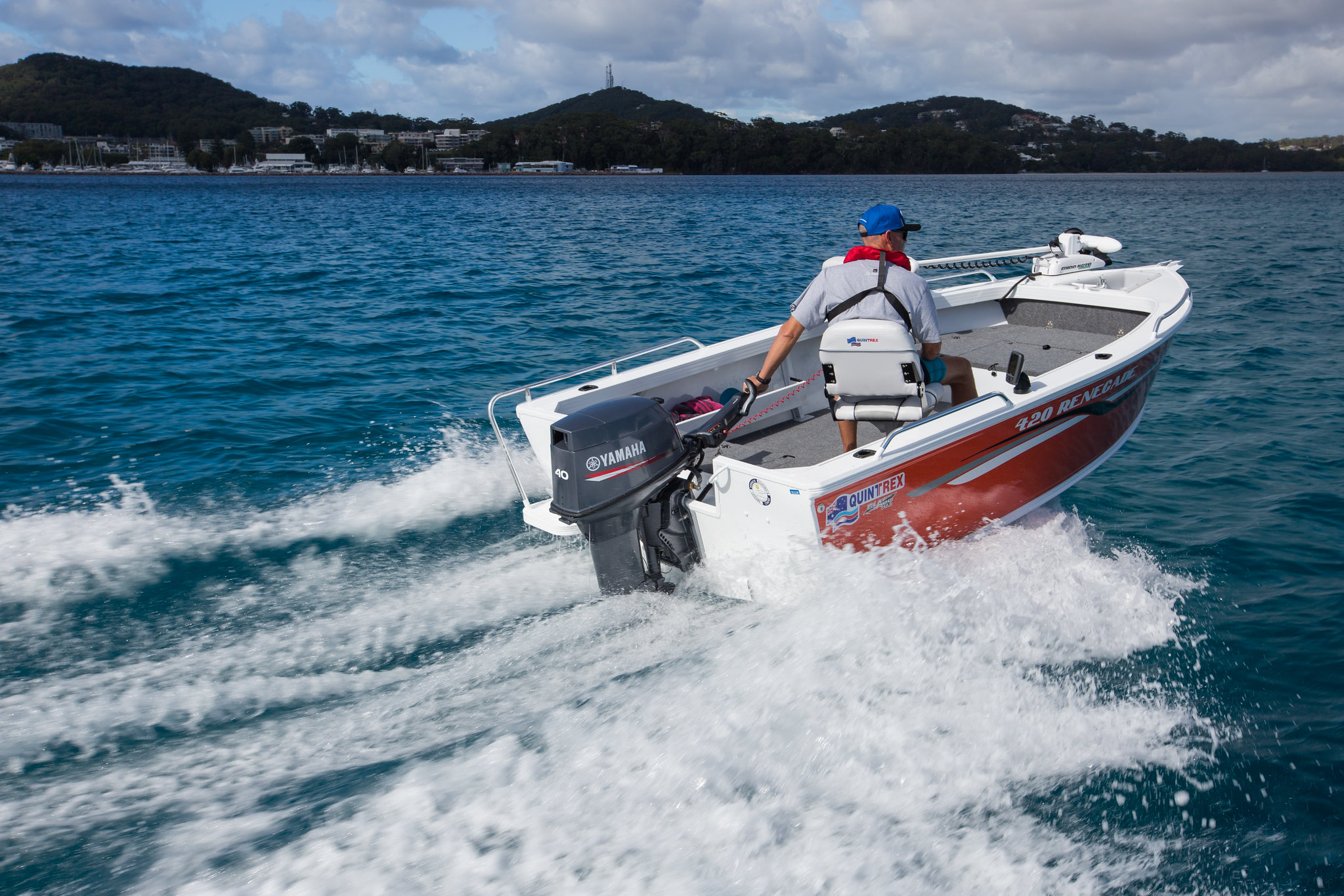 A man operating a Quintrex Renegade using a stiller outboard