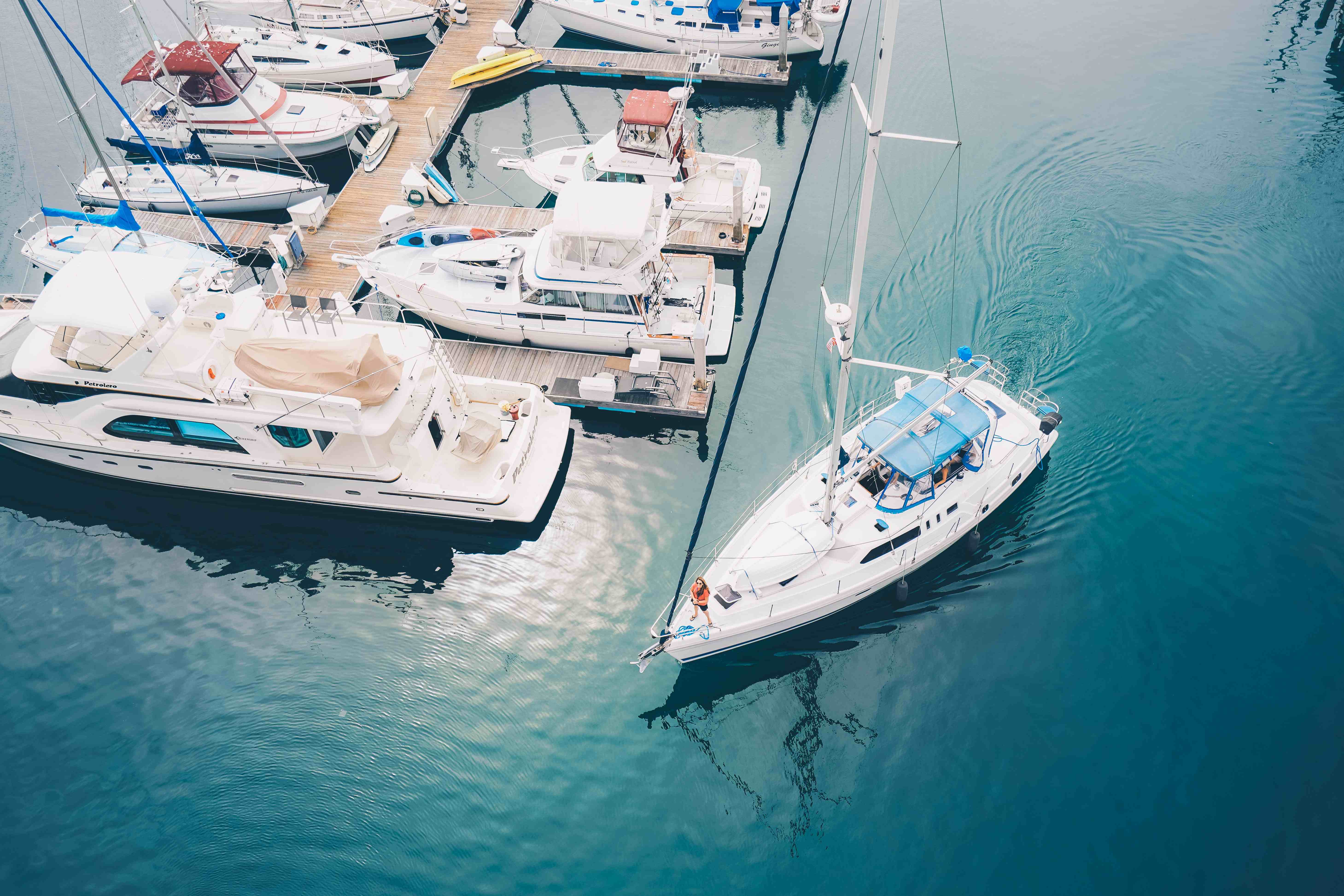 boats docked in a marina where they are exposed to moisture.