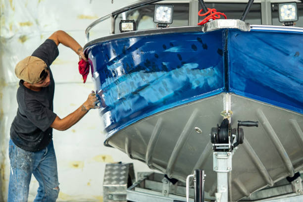 Man waxing a boat.