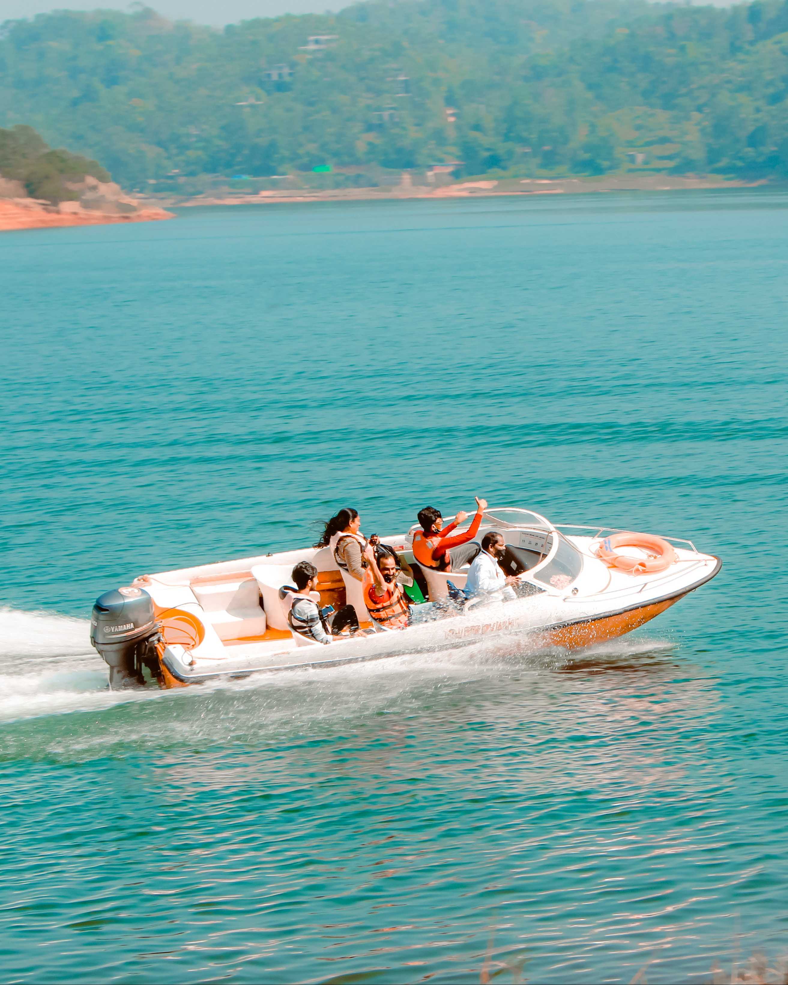 A family riding a moving family boat.