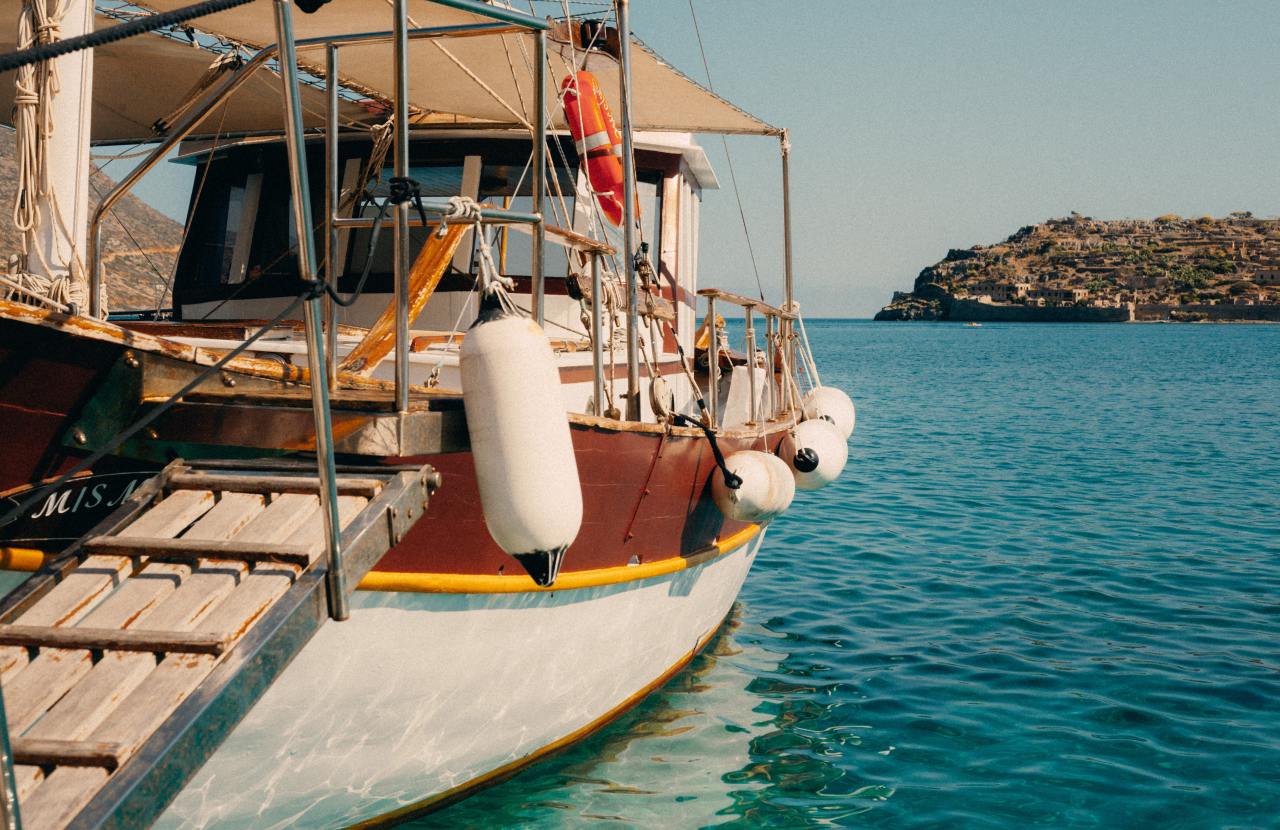 hard top boat docked at a pier