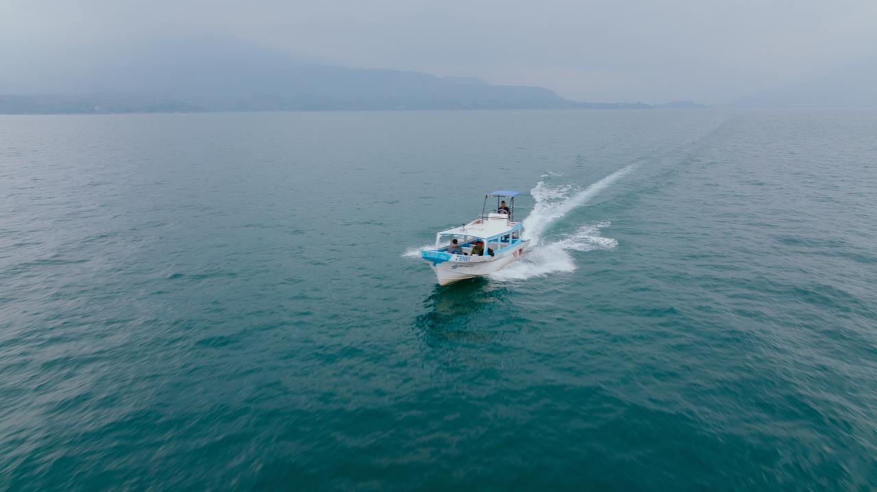 A boat trimming while underway at sea.