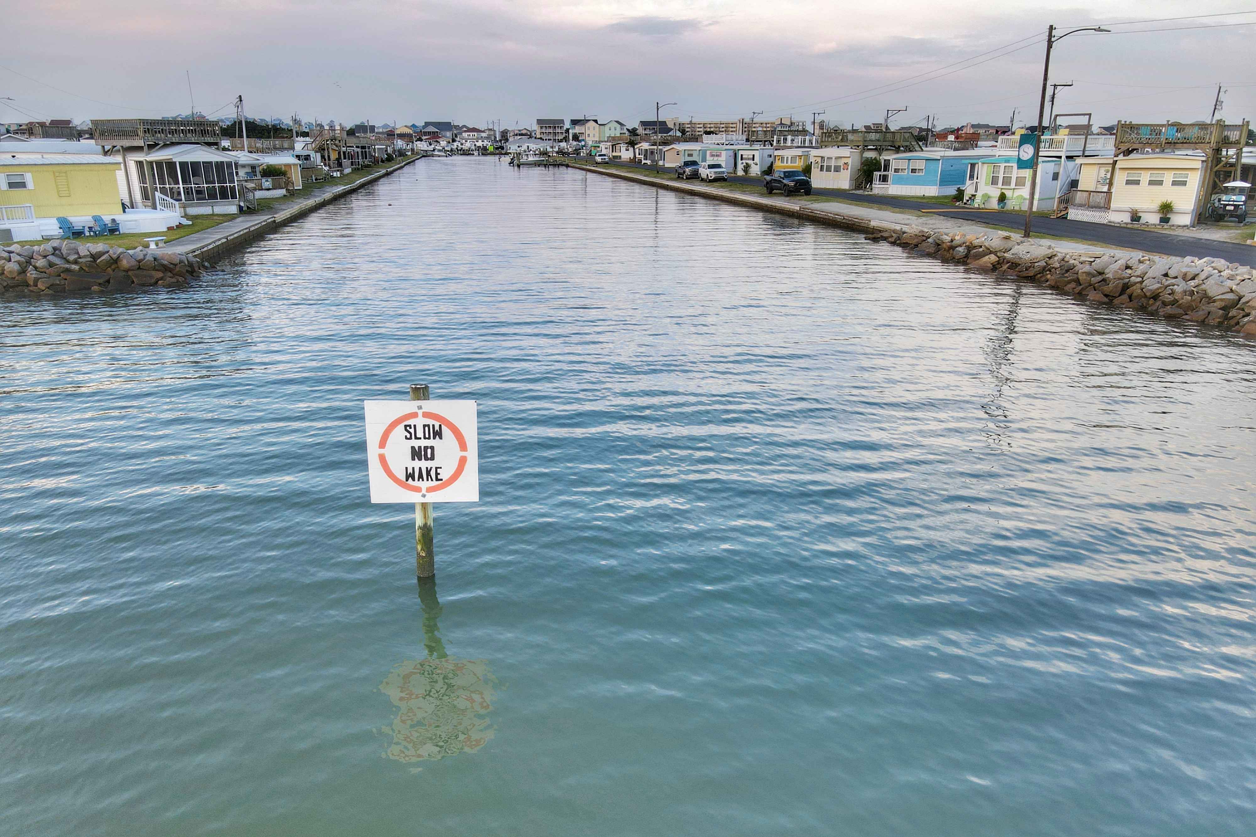 A waterway with a no wake sign