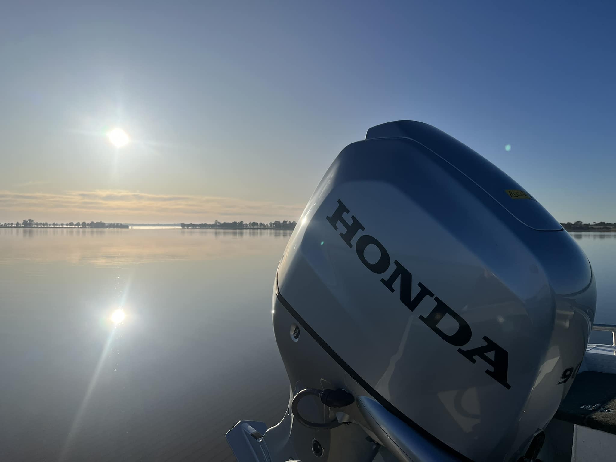 A close up view of a Honda boat engine.