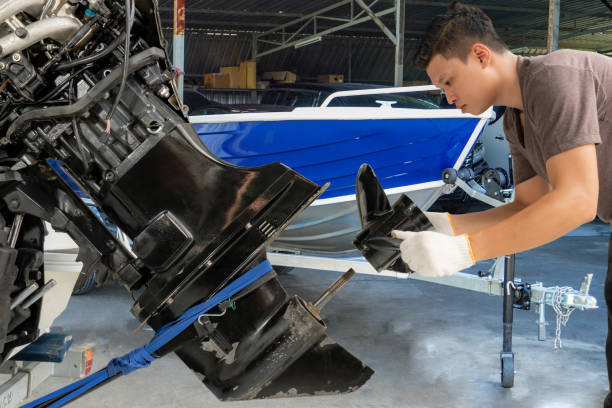 A marine mechanic working on an engine.