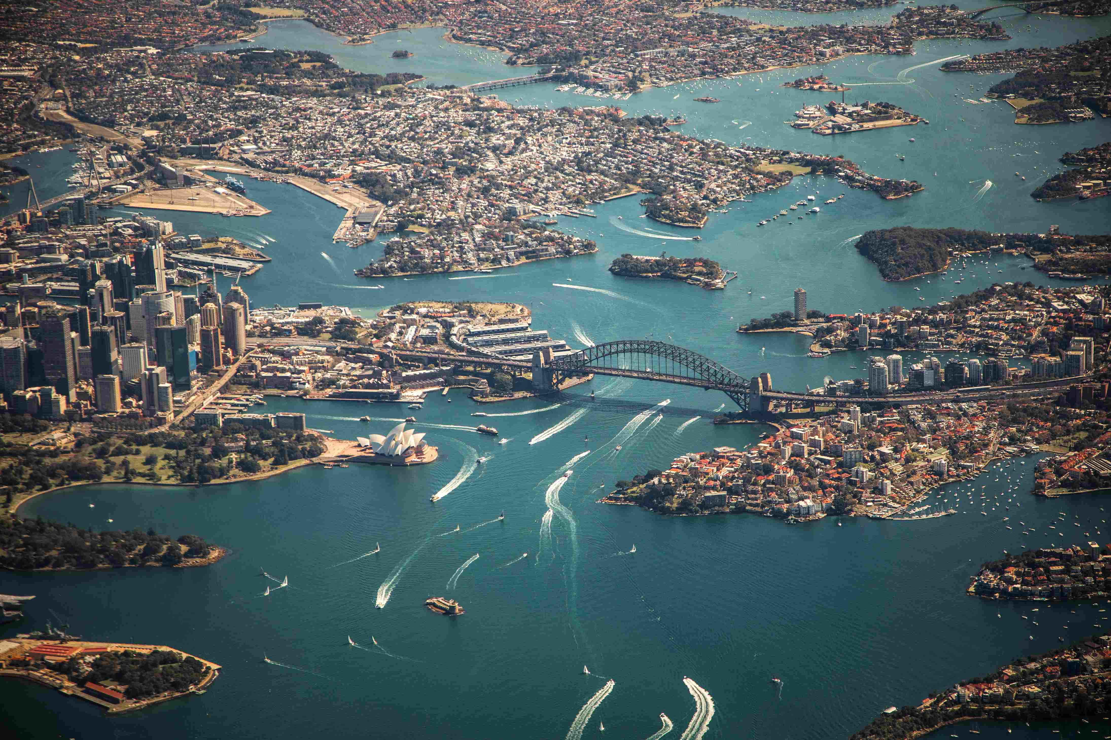 An eagle's eye view of boats cruising around Sydney Harbour.