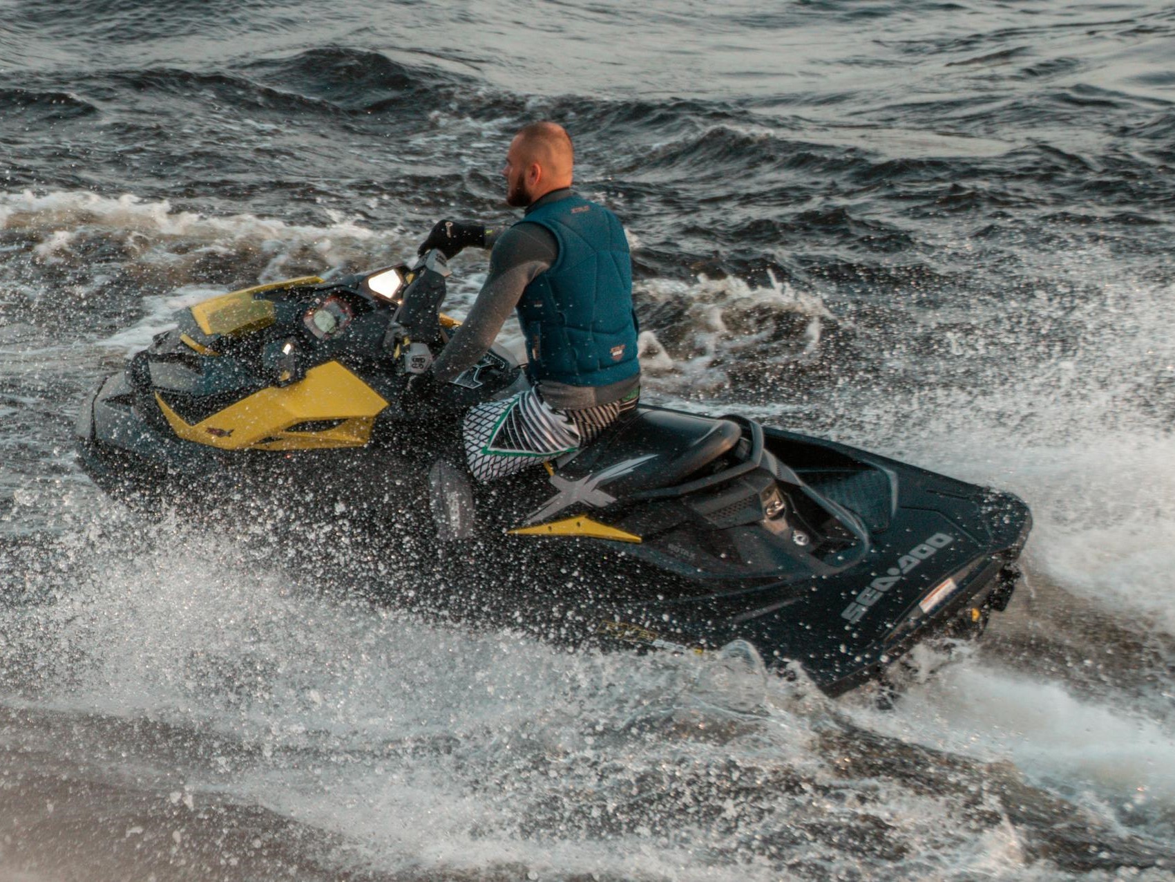 man riding on a sea doo jetski