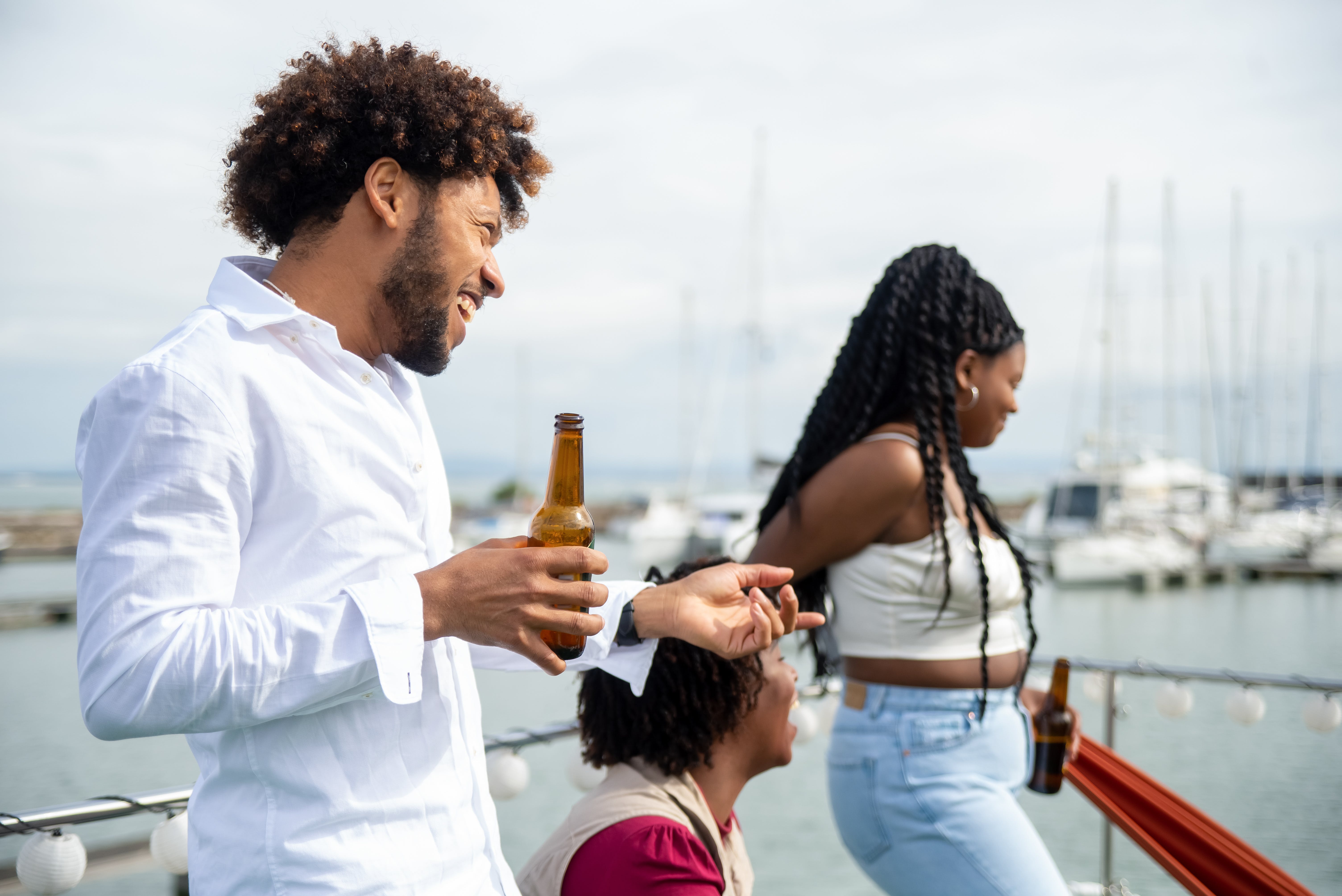 A cgroup of young people on a boat's deck