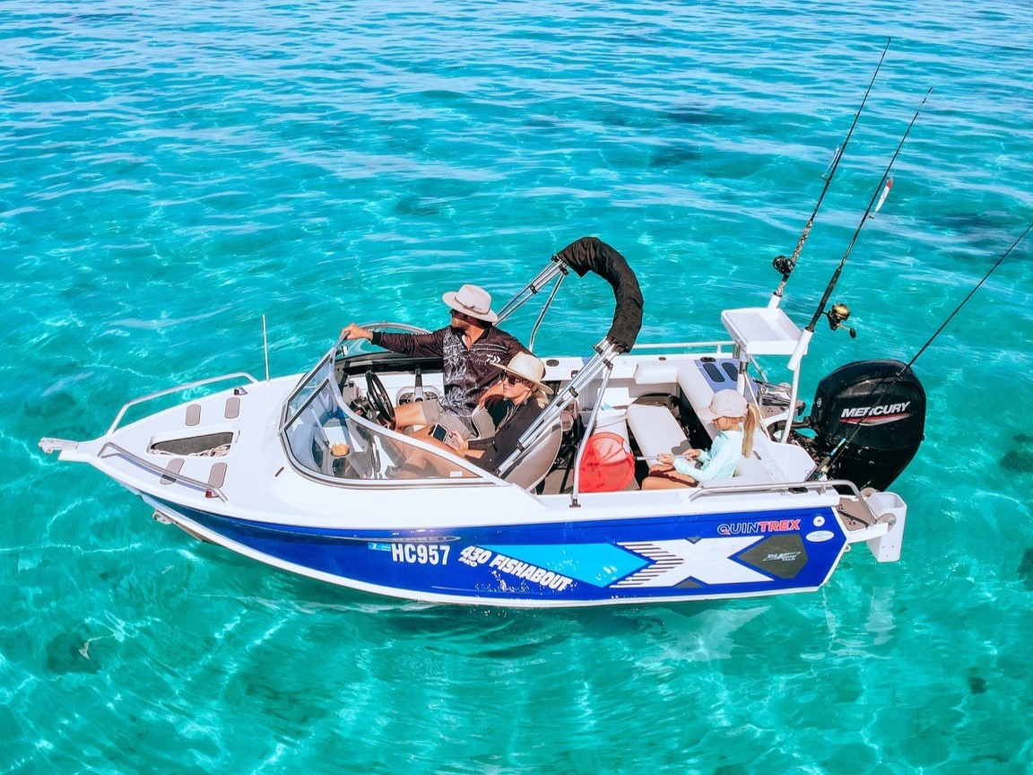 two people on a quintrex fishabout at sea