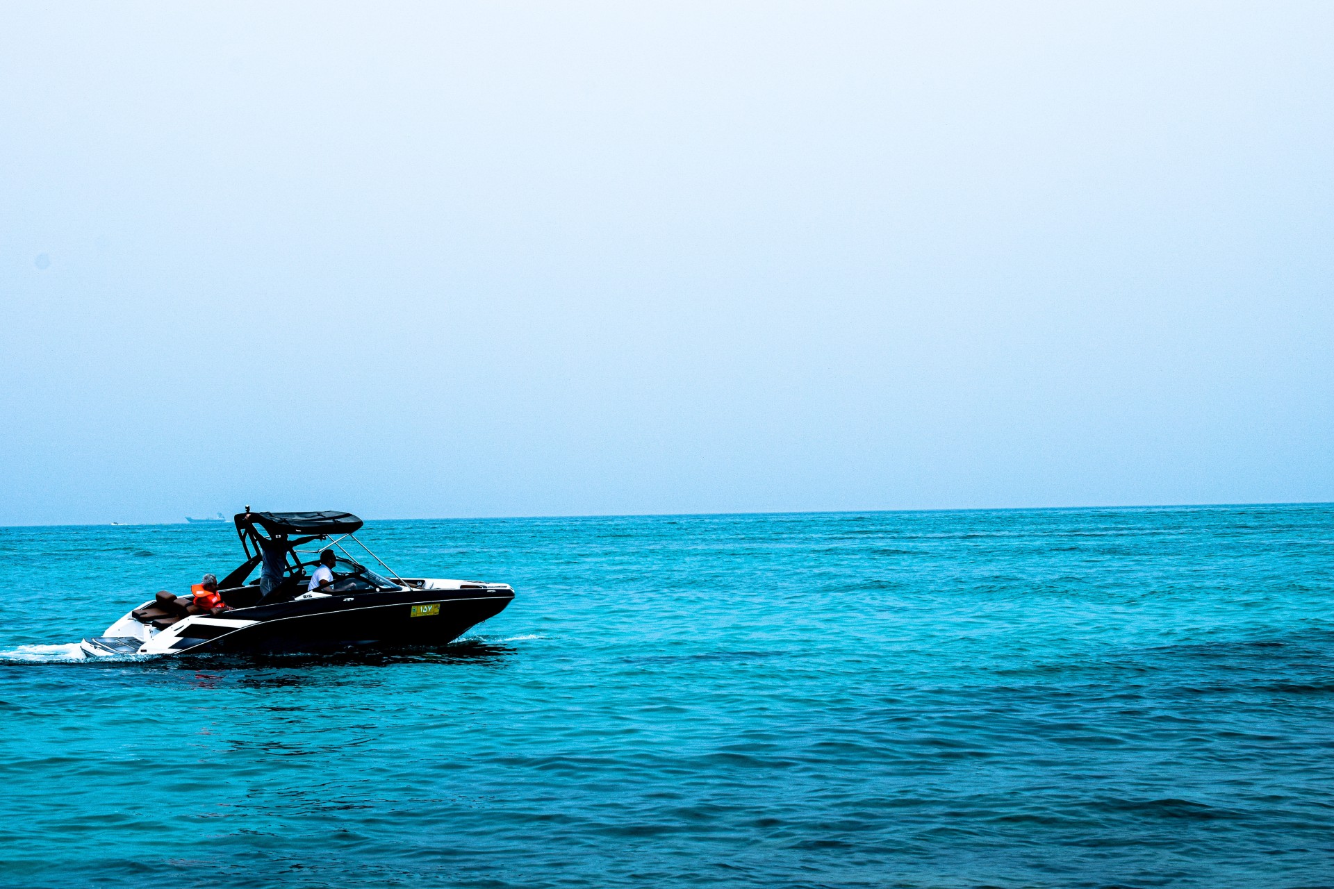 A ski boat underway at sea.