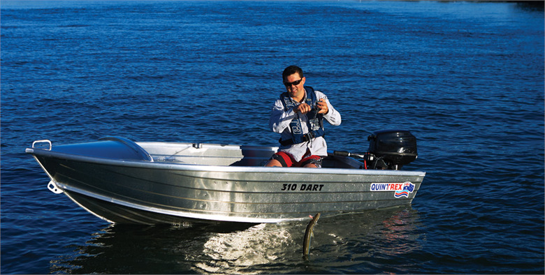 An angler sitting on a Quintrex tinnie boat.