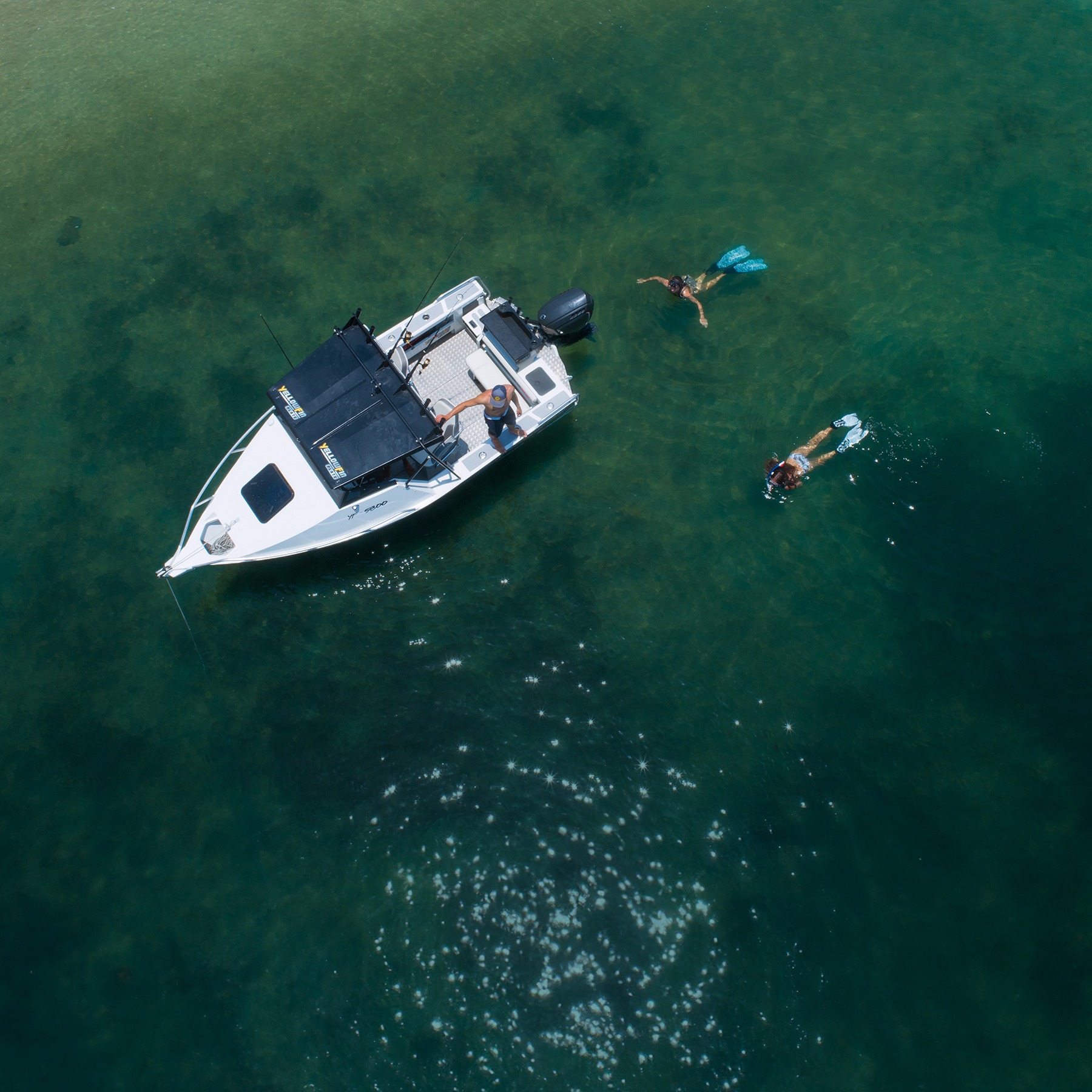 Yellowfin boat in a birds eye view angle.