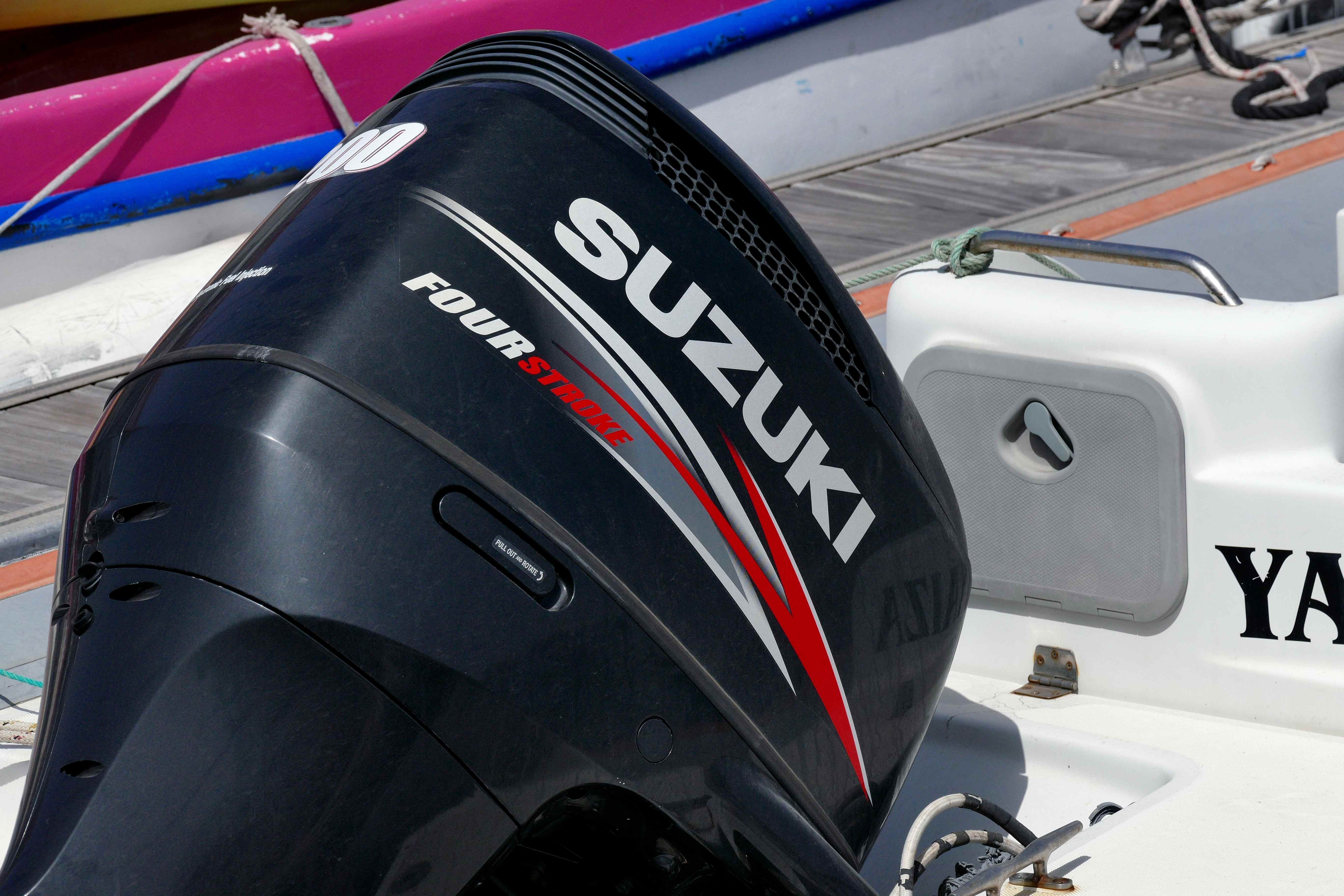 A close up of a Suzuki Four Stroke outboard.